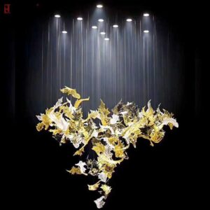 Luminous Drift chandelier with floating sculptural lighting design Modern luxury chandelier with suspended metallic elements Designer artistic chandelier for contemporary interiors Statement chandelier installation with ambient LED lighting Luxury hanging chandelier for dining and lobby spaces Contemporary ceiling chandelier with layered light composition