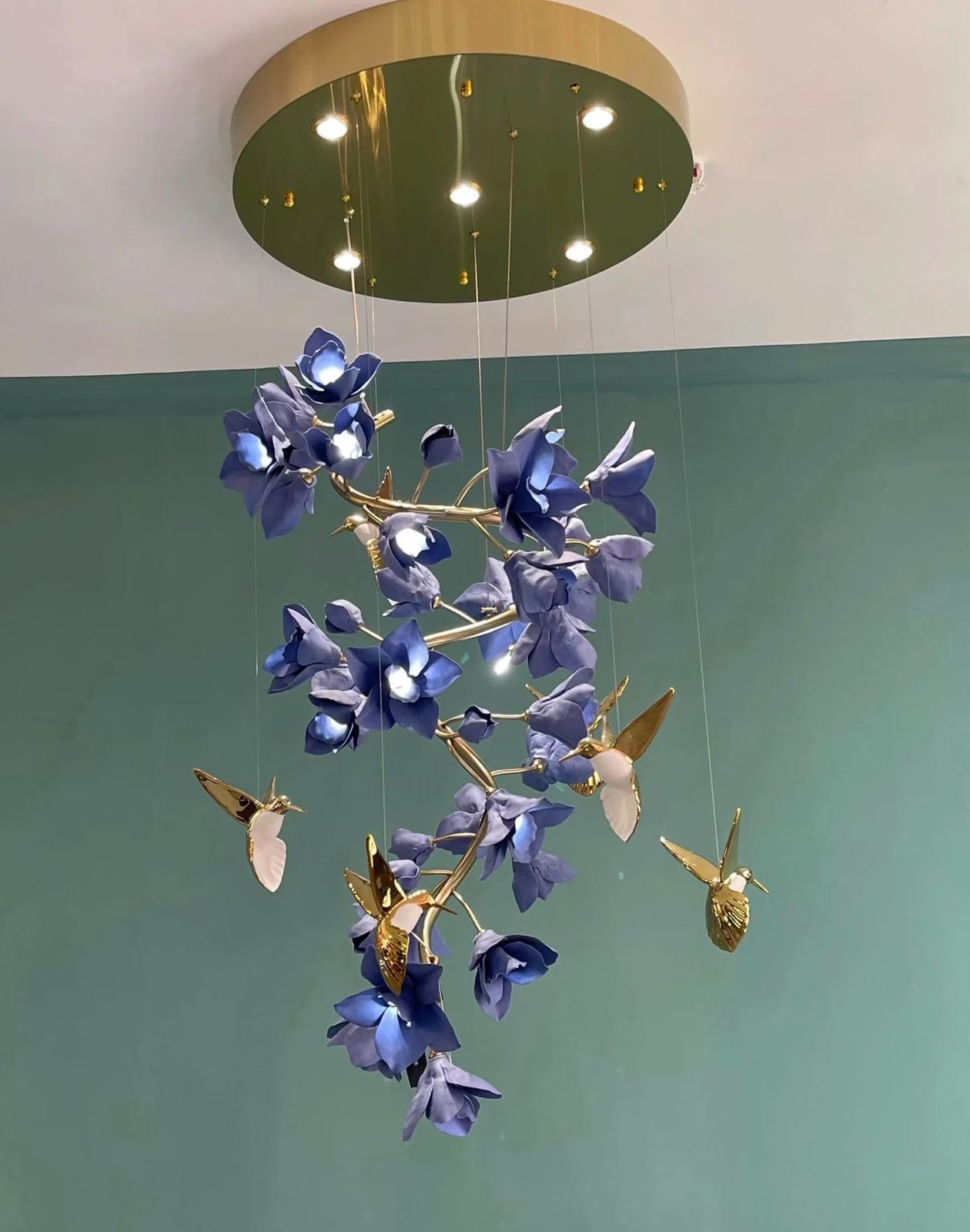 Celeste bloom chandelier floral LED chandelier India luxury floral chandelier for dining room lighting designer bloom chandelier with ambient LED glow modern chandelier with flower design for interiors decorative floral ceiling chandelier for living room brushed gold chandelier with floral elements elegant LED chandelier for luxury homes India contemporary floral chandelier for hospitality interiors ambient chandelier lighting with flower design designer chandelier for modern dining area India